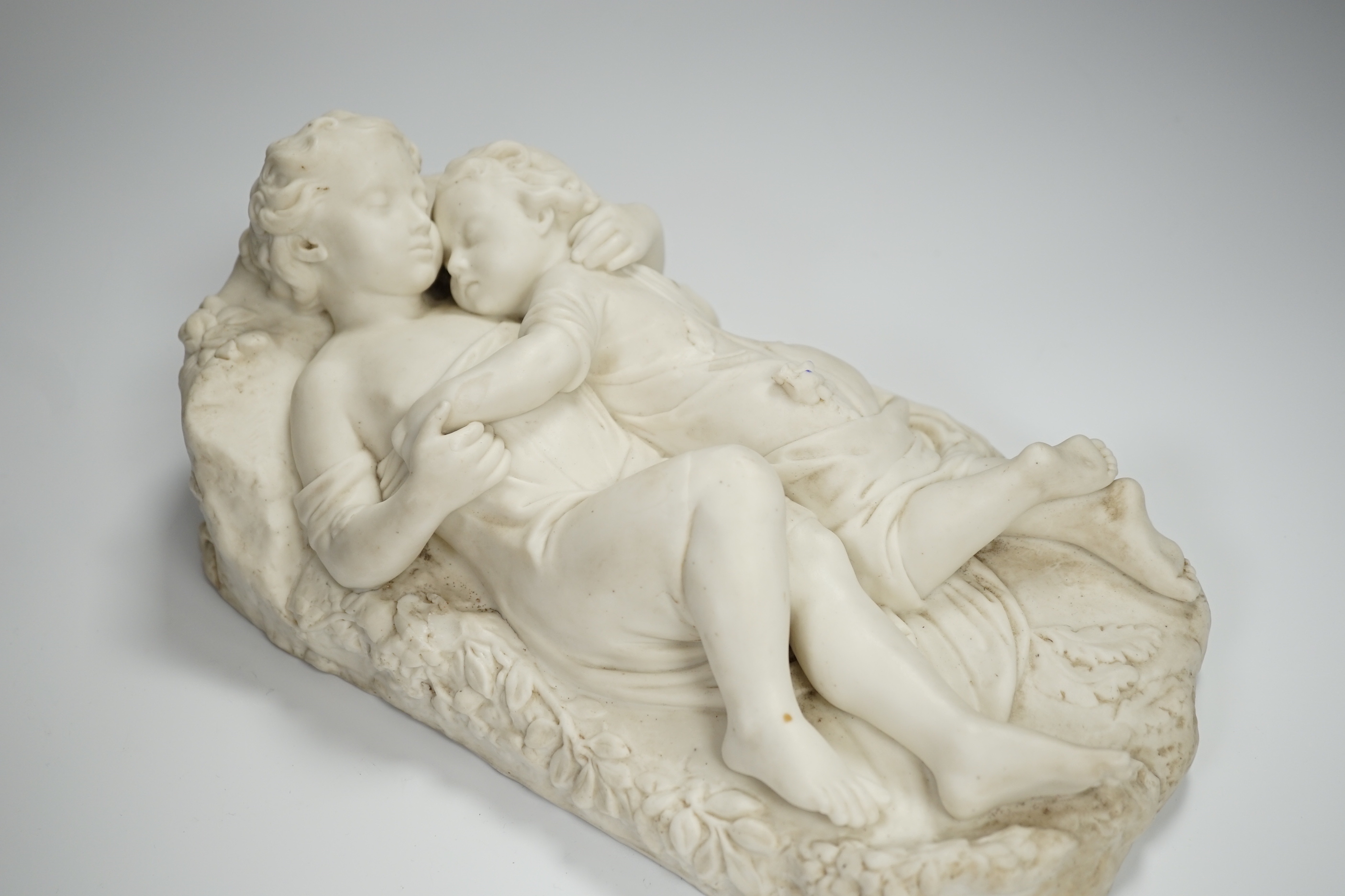 After John Bell, a Victorian parian reclining figure of a mother and child, 30cms wide